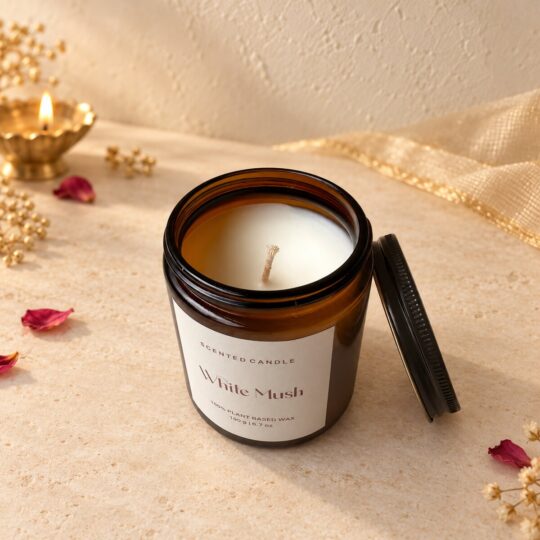 Amber glass candle jar opened to show the cream plant-based wax and wick, angled view