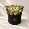 Tulip candle bouquet in Bangalore with white tulip candles and dried mustard baby's breath in a black hat box
