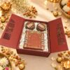 Open jharokha gift box with jaali-cut doors, two printed dry fruit jars and a matching jharokha-print inner box on satin