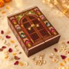 Closed Rajwada gift box with a printed palace window design, elephants, lotuses and a gold latch