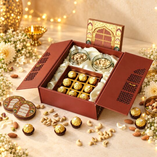 Open jharokha gift box with salted pistachio and cashew jars and a tray of 9 Ferrero Rocher, angled view