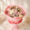 Strawberry Cream pastel mixed flower bouquet in Bangalore with pink and white roses, chrysanthemums and carnations in pink paper