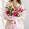 Woman holding an enlarged bouquet