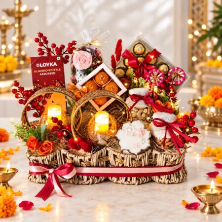 Diwali hamper basket with chocolates, dry fruit jars and LED candle holders, angled front view