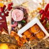 Scented potpourri pack with pink wax rose and box of laddoo candles, close-up