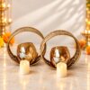 Gold metal twin candle holder set with amber glass bowls and 2 battery-operated LED candles
